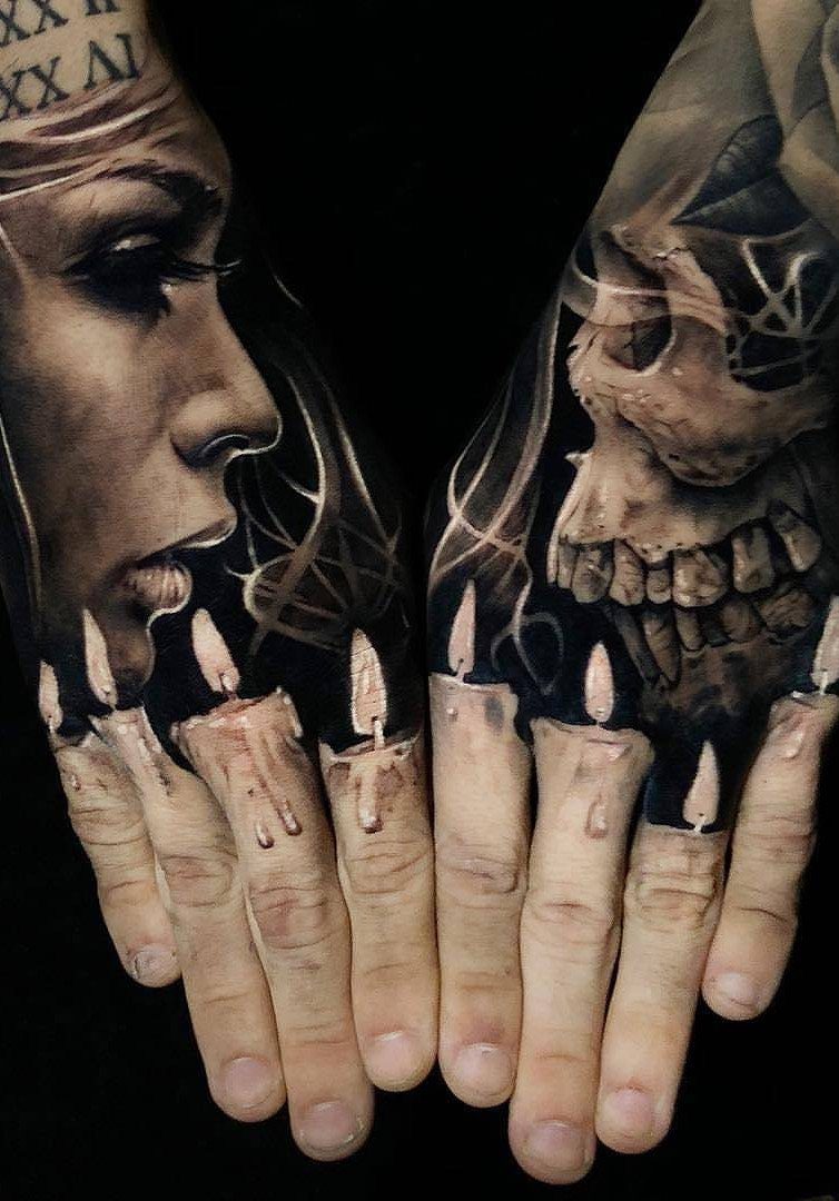 Tattoos on hands showing a woman, a skull, and dripping candles on fingers.