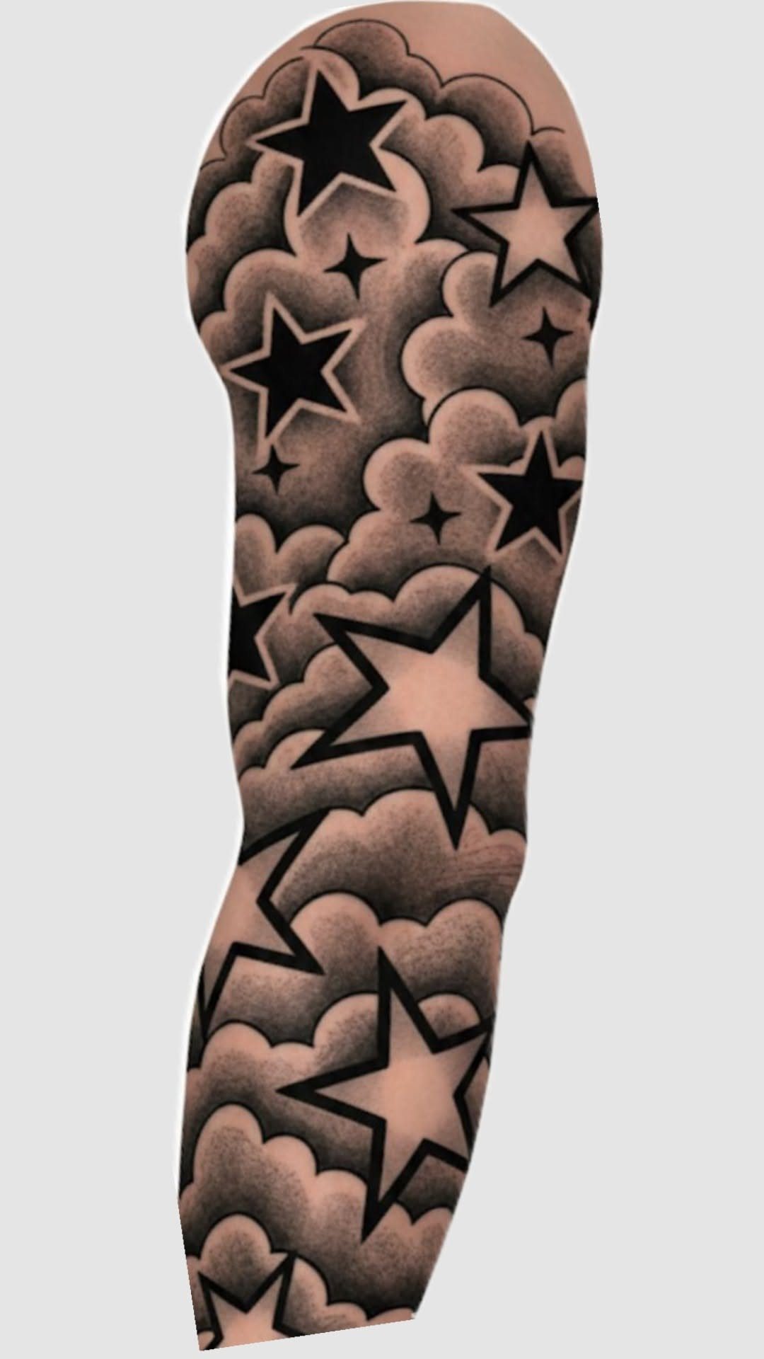 Tattoo of shaded grey clouds and black stars covering a person's arm.