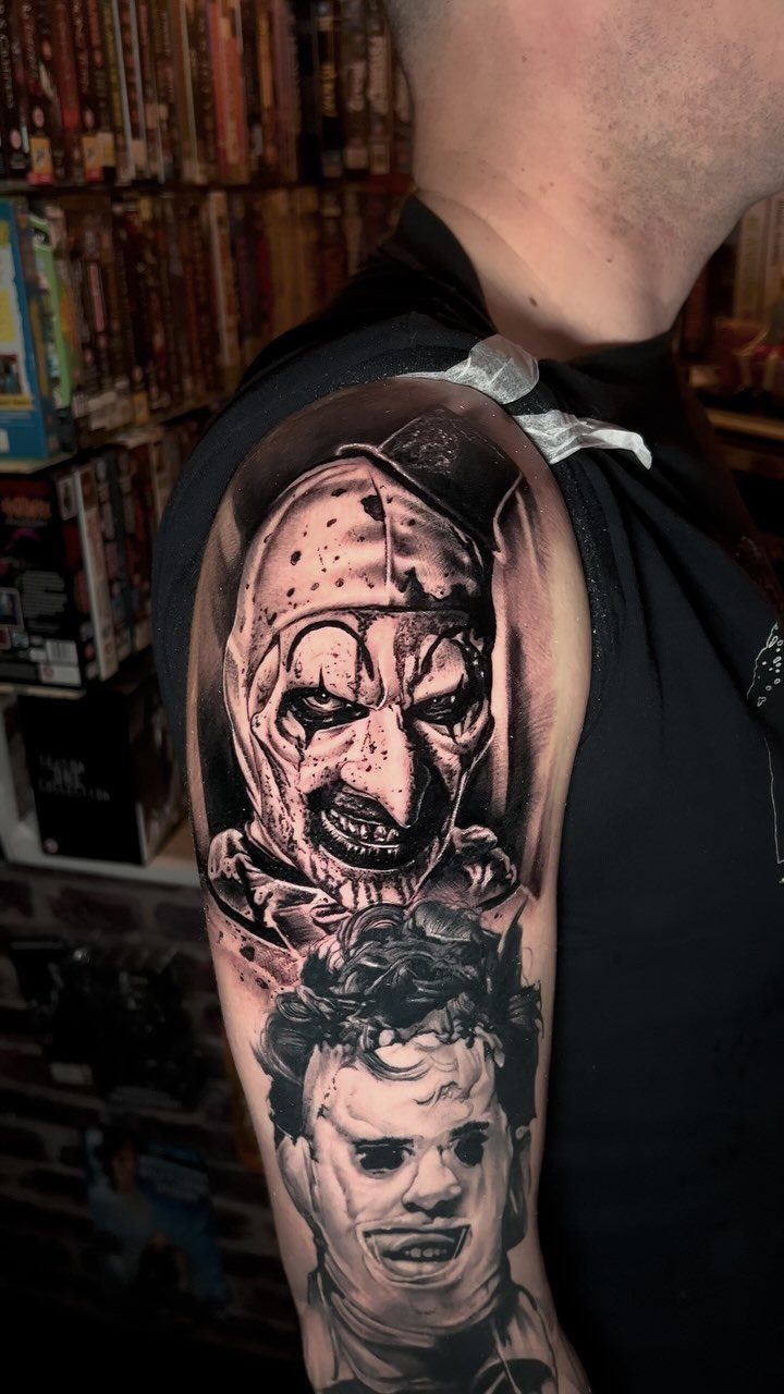 Horror movie character tattoos of Art the Clown and Michael Myers on an arm.