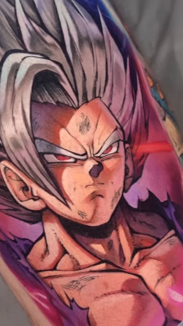 Beast Gohan tattoo with silver hair and red eyes on a person's skin