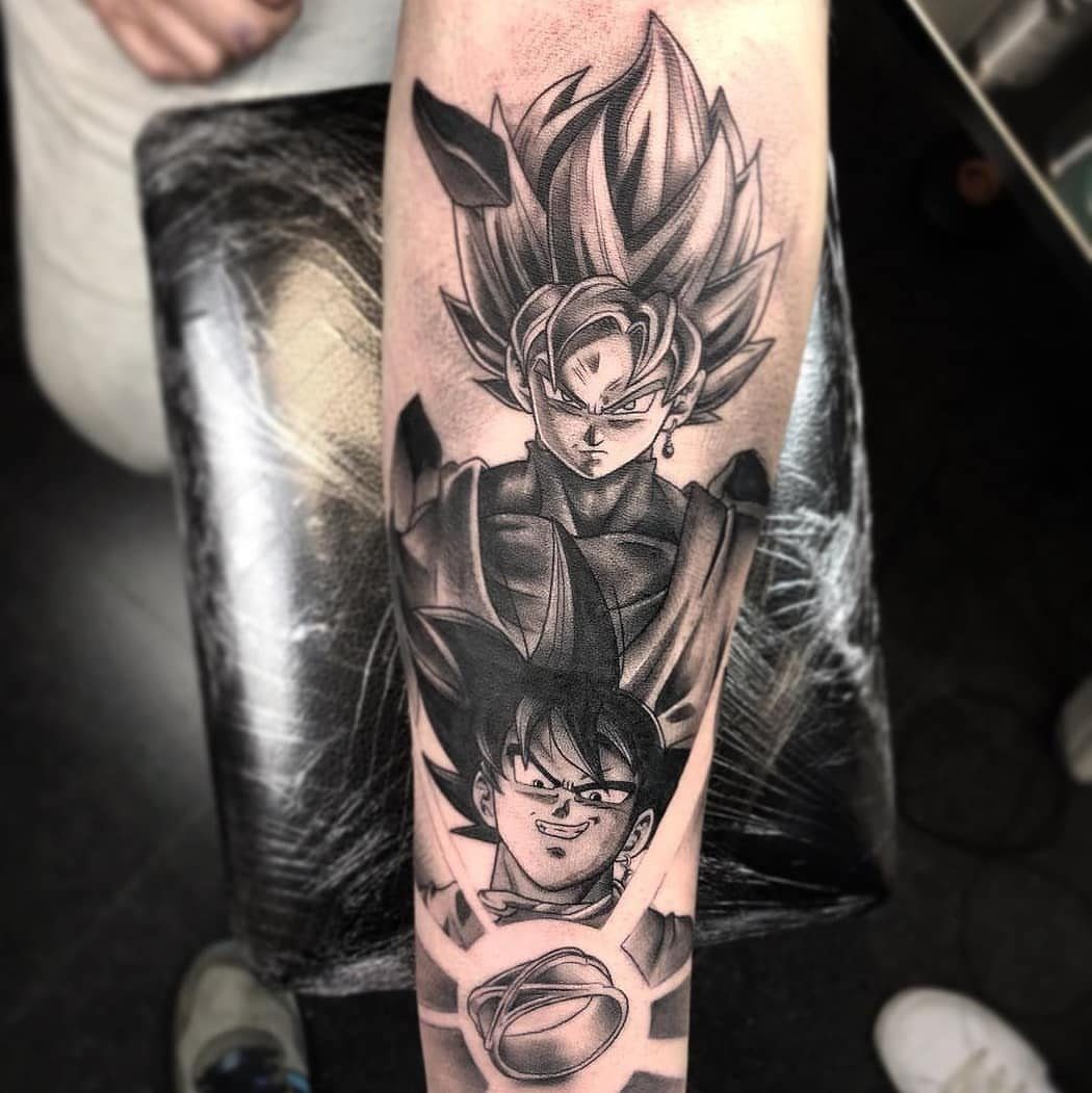 Dragon Ball tattoo on a forearm featuring Goku and Gogeta in black and grey ink.