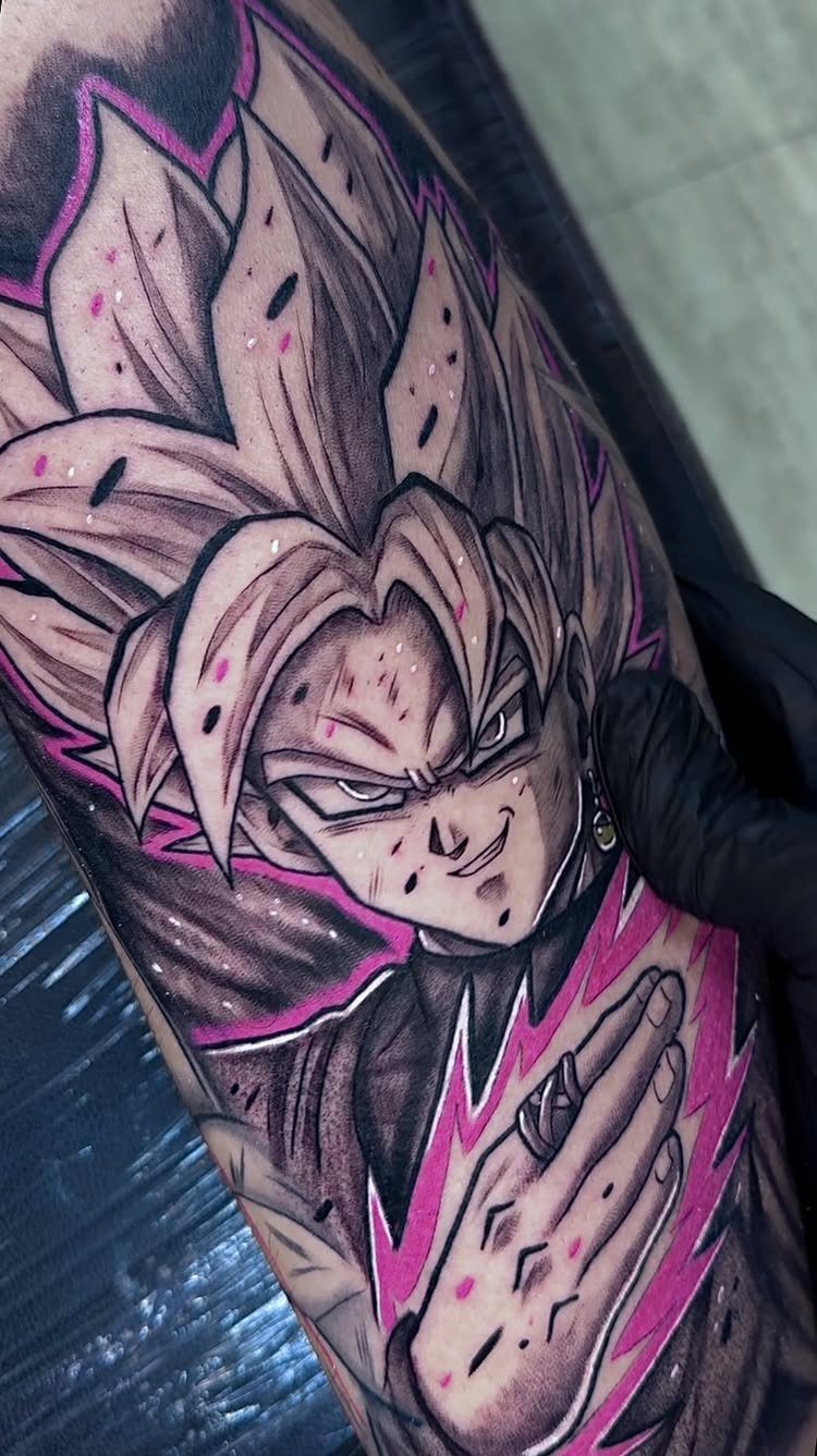 Goku Black tattoo with pink energy aura and spiky hair on skin