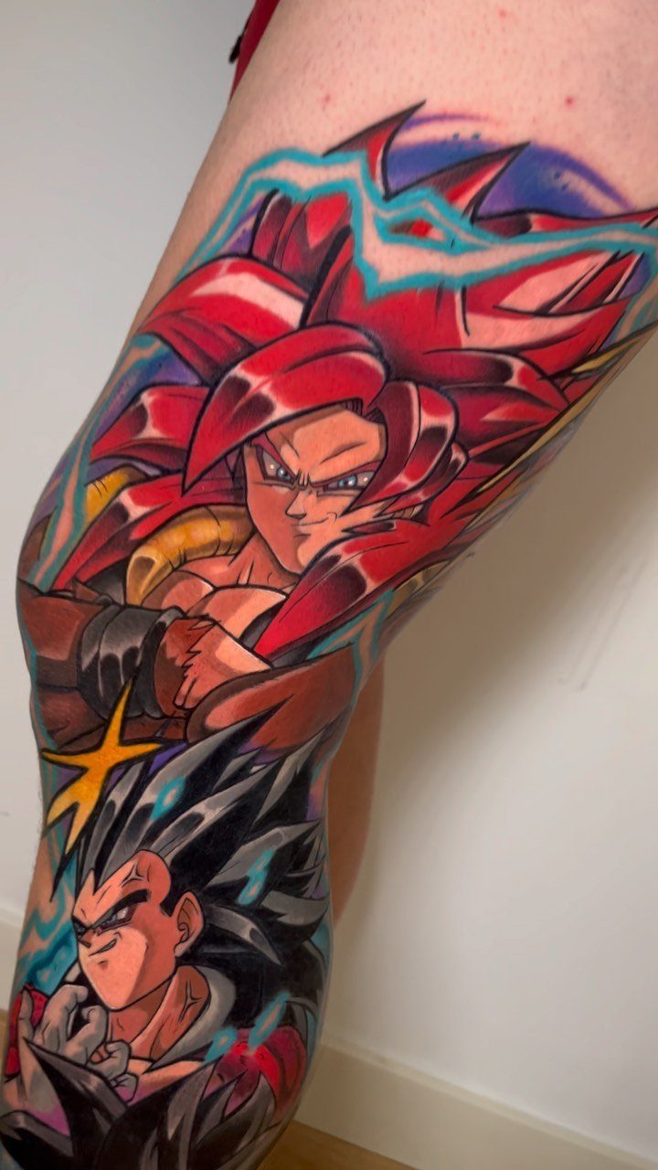 Colorful Dragon Ball tattoo on a leg featuring Goku and Vegeta characters.