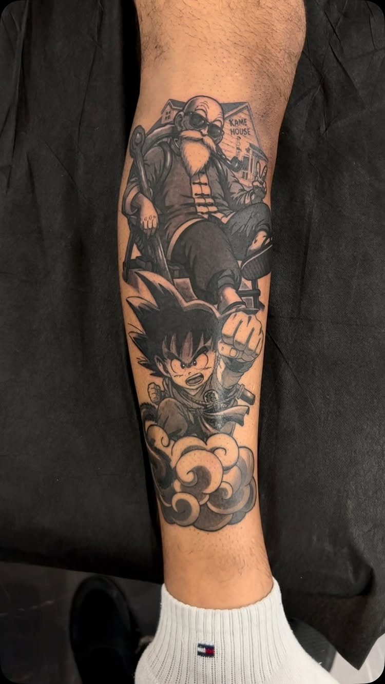 Tattoo of Master Roshi and young Goku on a person's lower leg.