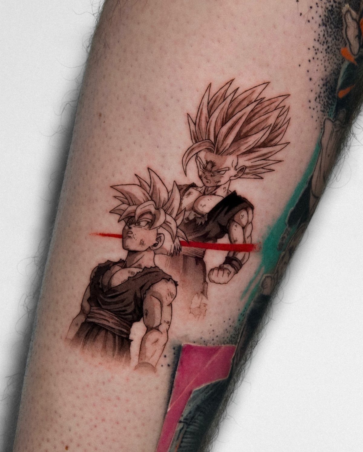 Tattoo of child and adult Son Gohan on a person's arm.