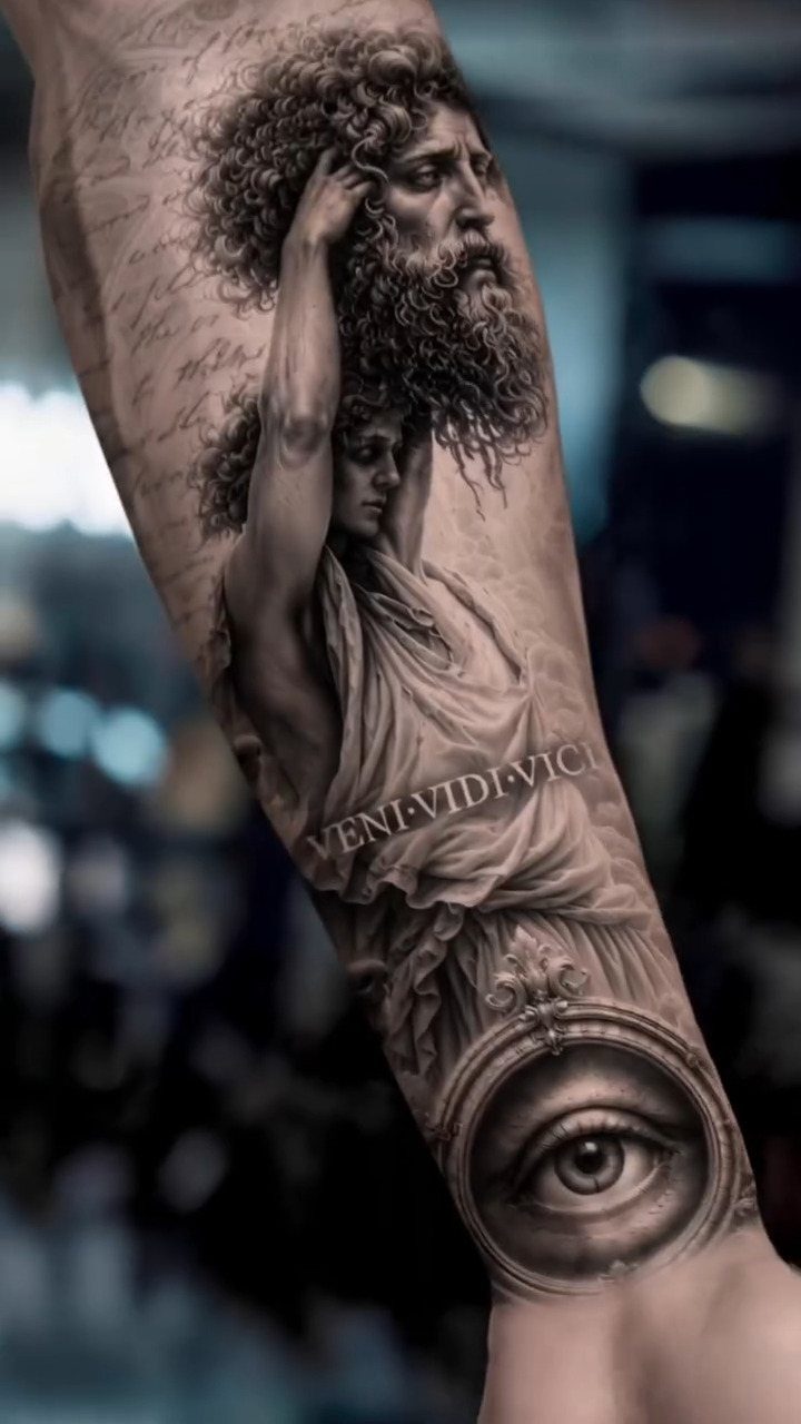 Hyper-realistic black and grey tattoo on an arm featuring classical figures and an eye.