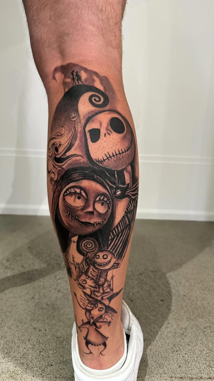 Black and grey leg tattoo featuring Jack Skellington and Sally from The Nightmare Before Christmas.