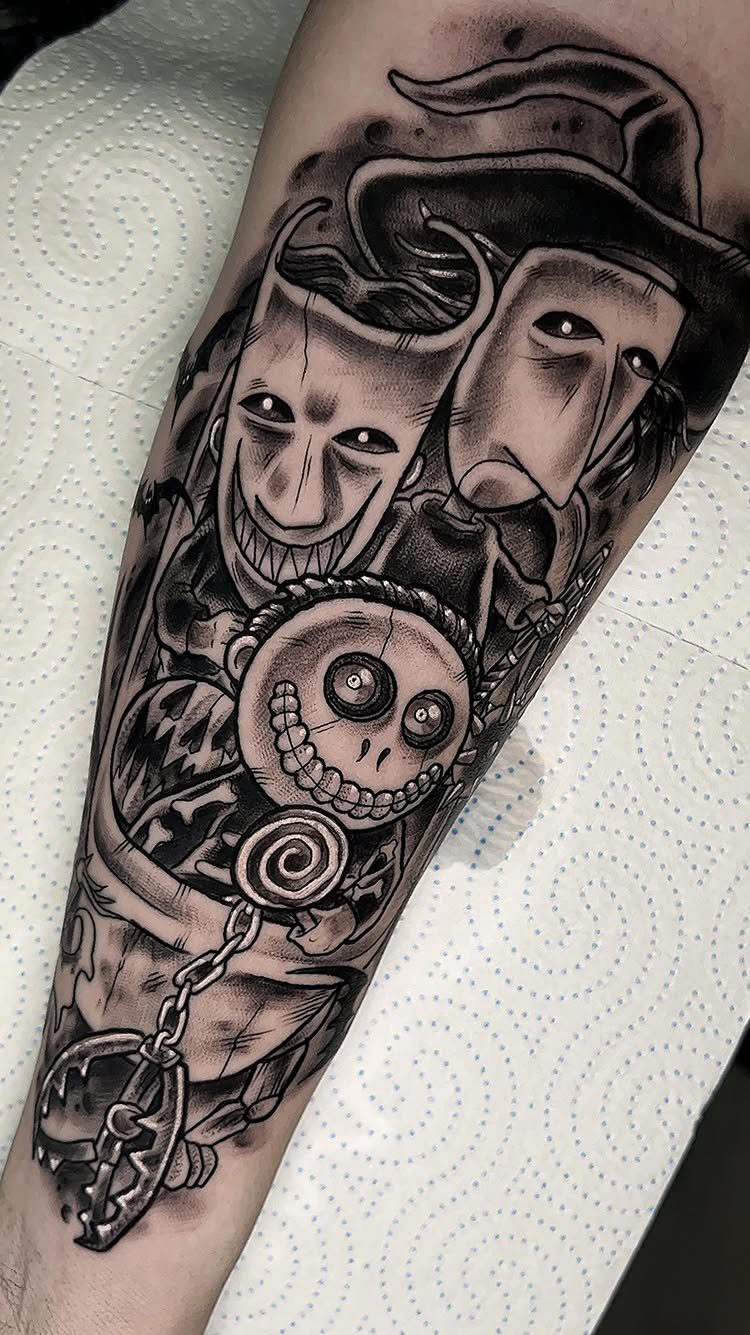Nightmare Before Christmas tattoo of Lock, Shock, and Barrel on a person's arm
