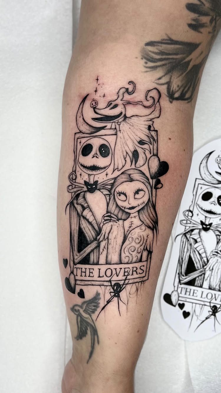 Black and white tattoo of Jack and Sally in a tarot card frame.