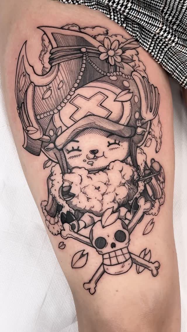 Tony Tony Chopper tattoo with a skull and crossbones on a person's leg