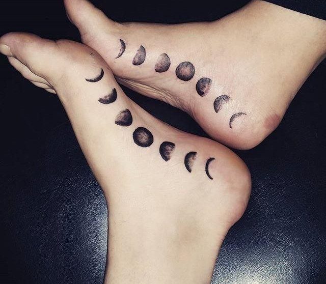 Matching moon phase tattoos on the ankles and heels of two people.