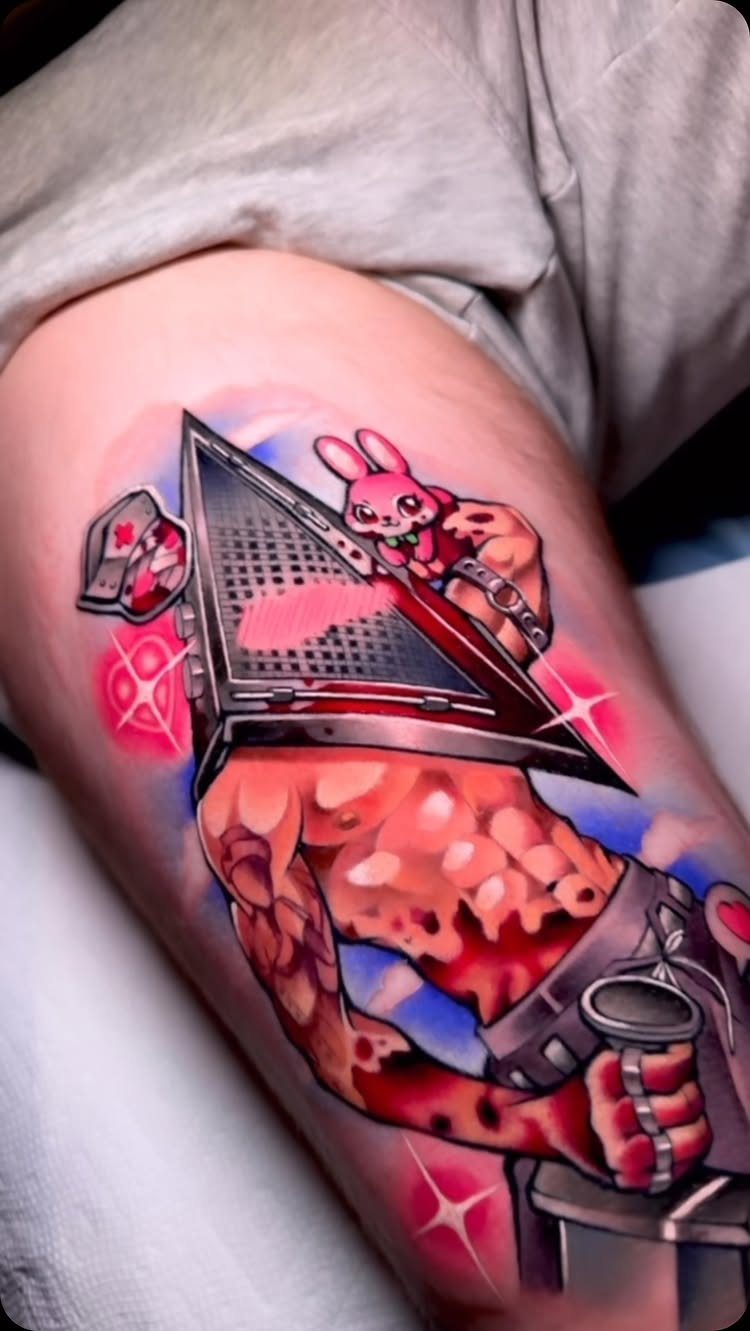 Pyramid Head tattoo with a small pink bunny on his shoulder on a leg