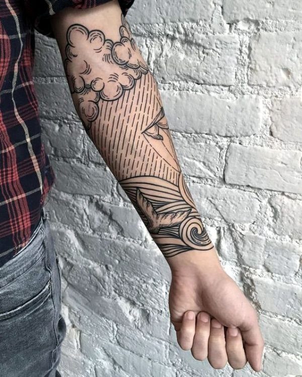 Storm cloud tattoo with rain and ocean waves on a person's forearm