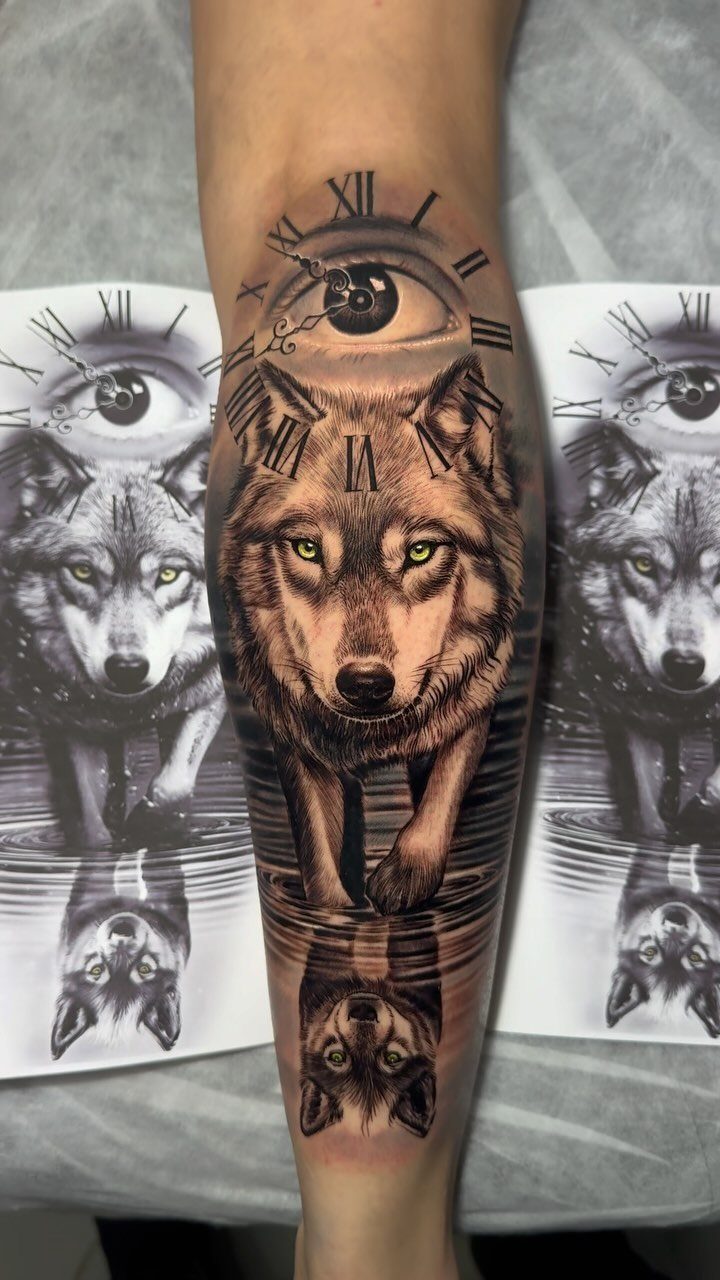 Wolf tattoo on forearm with a large eye and clock numerals above it