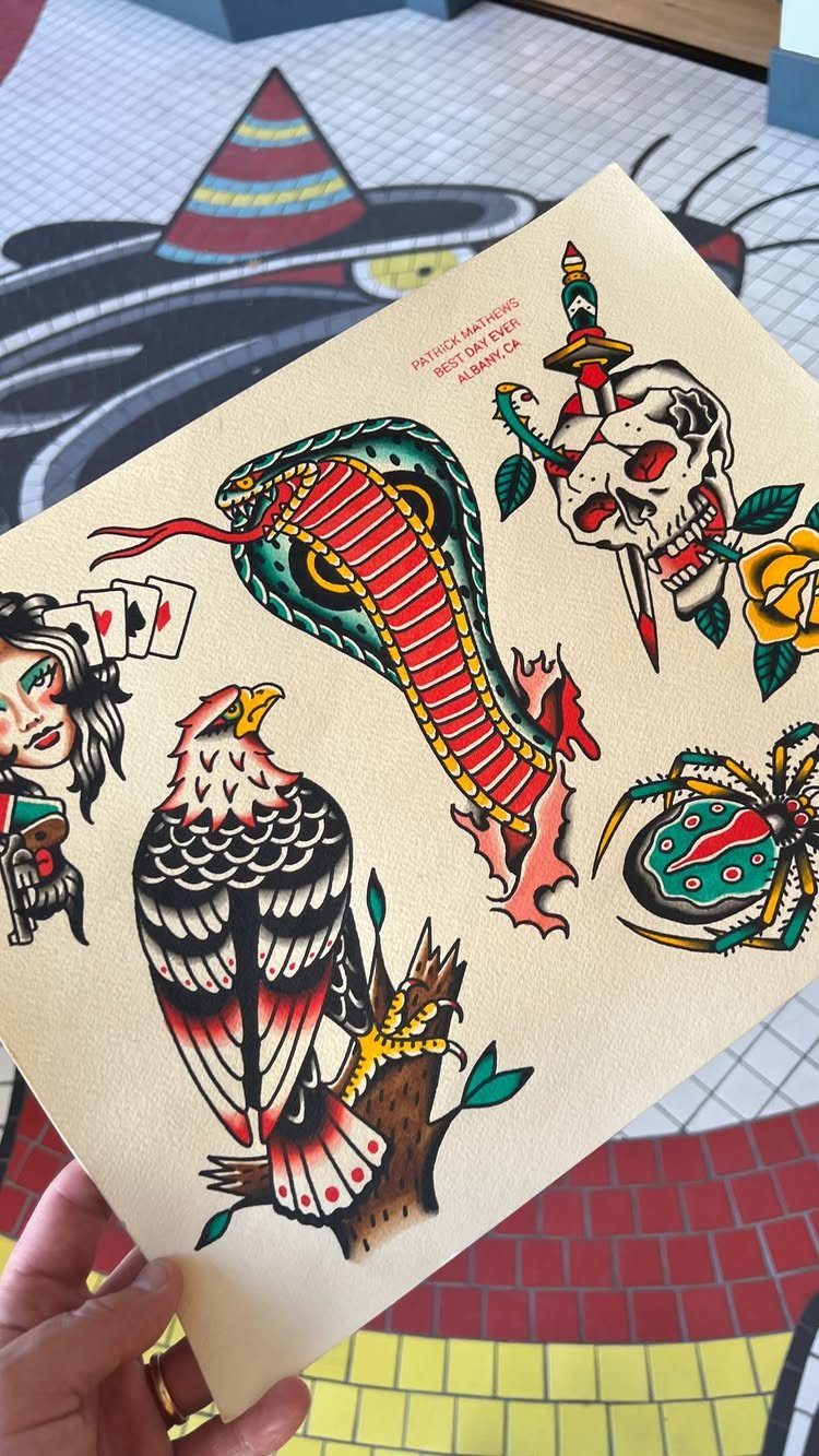 Tattoo flash sheet with traditional designs of an eagle, cobra, skull, and spider.